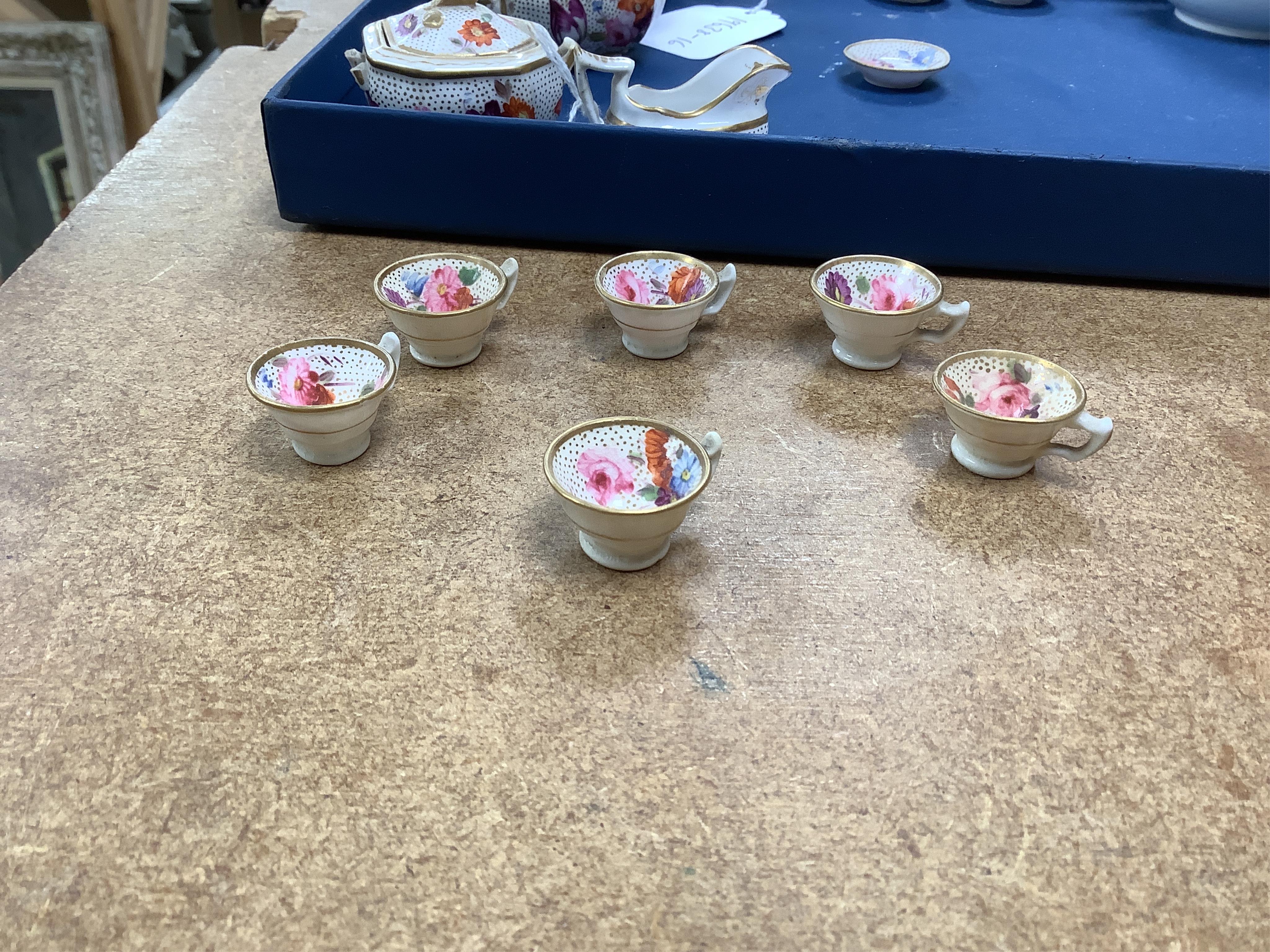 A pair of Meissen Marcolini period floral custard cups & covers together with an early 19th century English porcelain miniature tea set on tray, largest 20cm wide